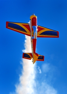 This photo of a radio-controlled airplane going vertical was taken by an unknown photographer.